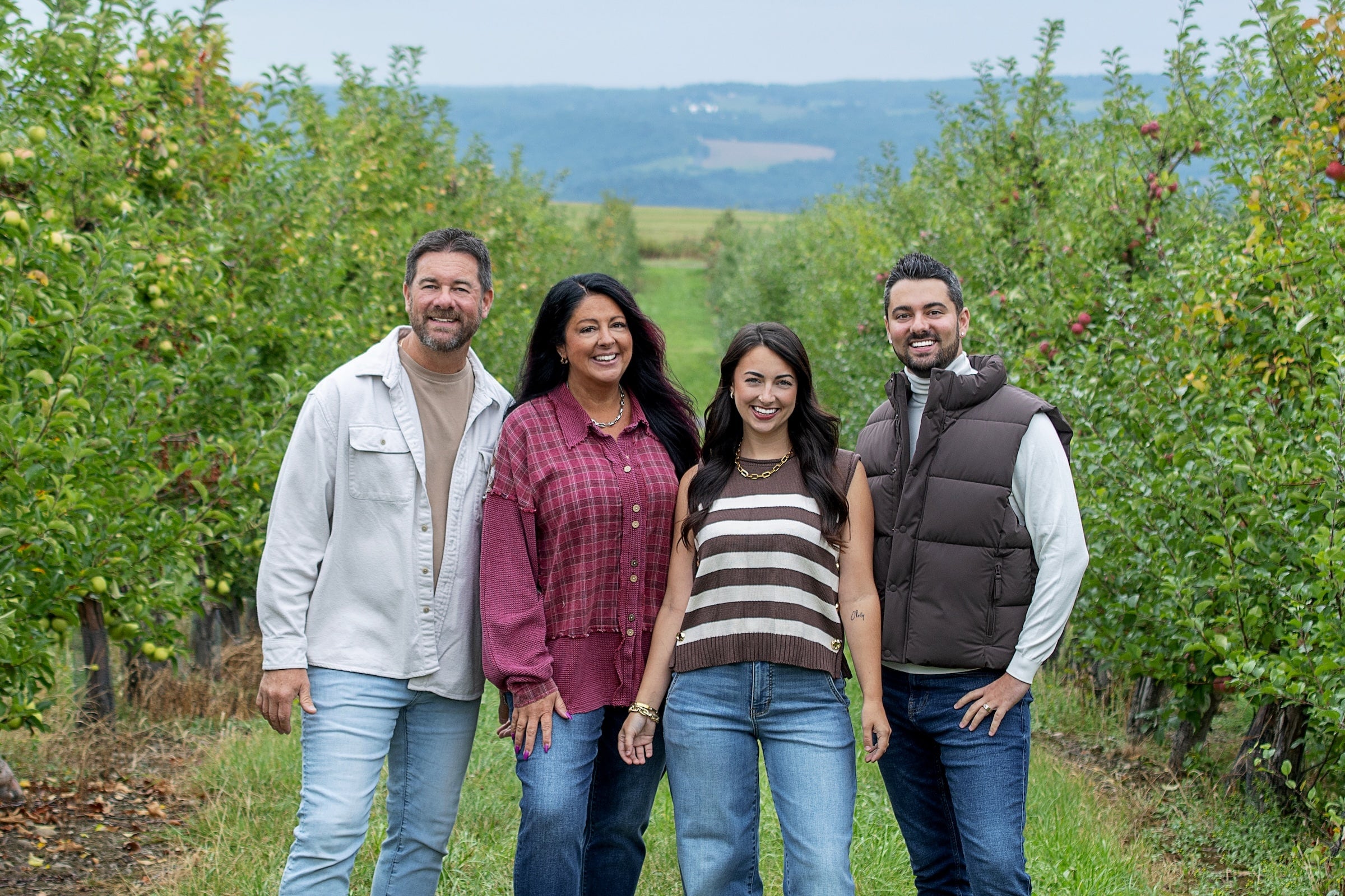 The O’Reillys family in an apple orchard