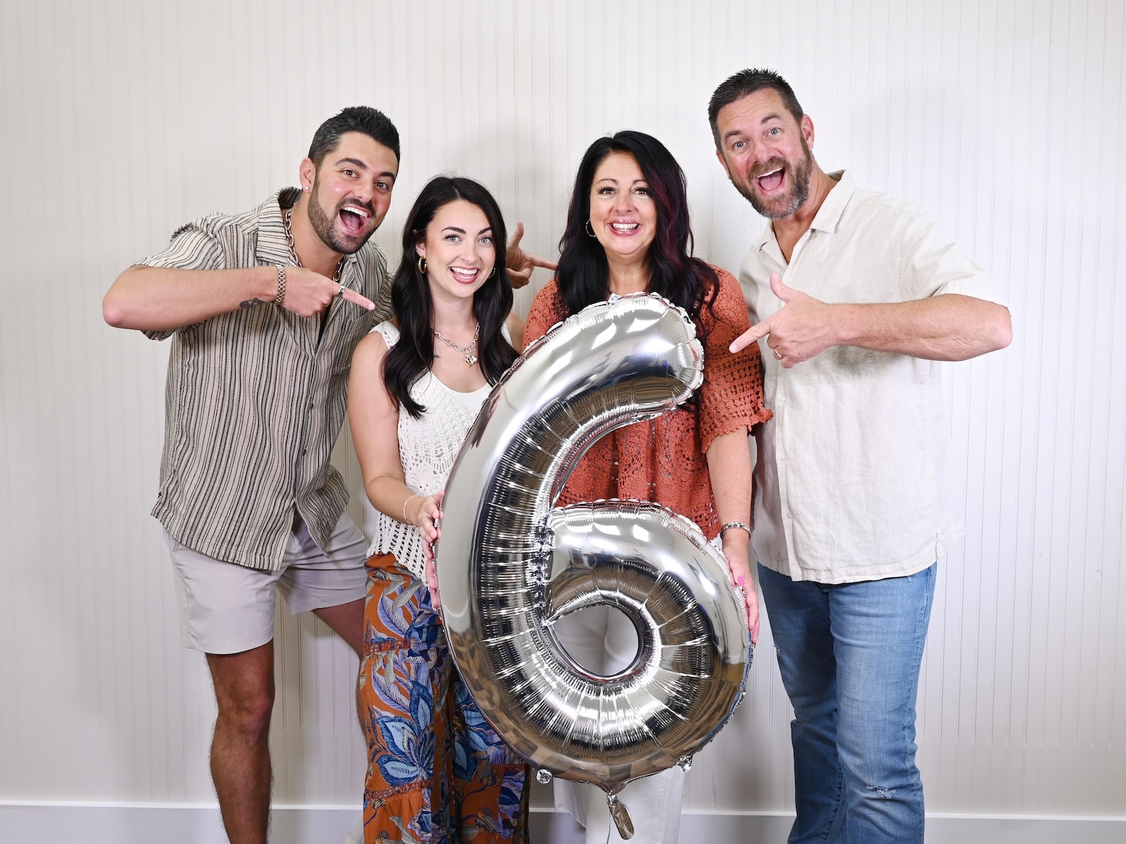 The O’Reilly family with a silver number-six balloon